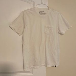 Plain white Hurley tee with front pocket. Size large.